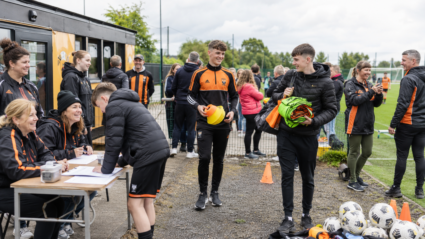 Photorealistic scene of parents and student volunteers helping at a community soccer club